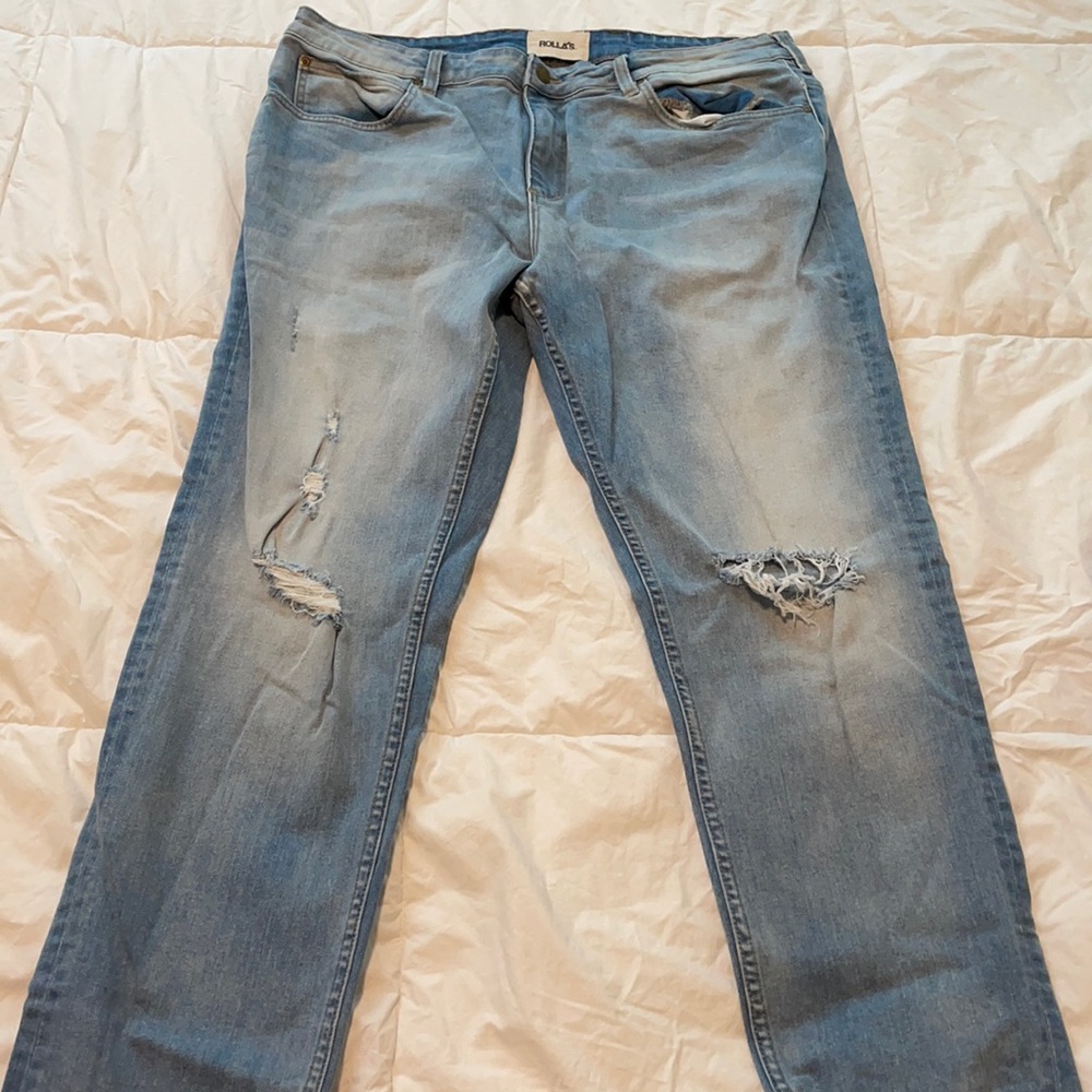 ROLLA’S.  Distressed blue skinny jeans.  Like new.